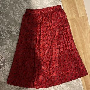 Red silk skirt, mid length